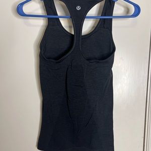 Lululemon workout top with built in bra. Pads included.
